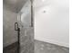 Modern bathroom with gray hexagon tile flooring and walk-in shower with glass door at 441 Pumpkinvine Rd, Acworth, GA 30101
