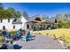 Modern farmhouse with a fire pit, gravel area, and inviting outdoor space at 441 Pumpkinvine Rd, Acworth, GA 30101
