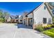 View of exterior showcasing a brick and siding facade, spacious driveway and three car garage at 441 Pumpkinvine Rd, Acworth, GA 30101