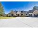 Stunning exterior showcasing a brick and siding facade, well-manicured lawn, and a spacious driveway at 441 Pumpkinvine Rd, Acworth, GA 30101