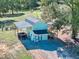 Charming backyard building with blue siding, a dark roof, and a covered shed at 441 Pumpkinvine Rd, Acworth, GA 30101