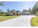 Stunning exterior showcasing a brick and siding facade, well-manicured lawn, and a spacious driveway at 441 Pumpkinvine Rd, Acworth, GA 30101
