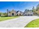 Stunning exterior showcasing a brick and siding facade, well-manicured lawn, and a spacious driveway at 441 Pumpkinvine Rd, Acworth, GA 30101