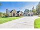 Stunning exterior showcasing a brick and siding facade, well-manicured lawn, and a spacious driveway at 441 Pumpkinvine Rd, Acworth, GA 30101