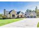 Stunning two-story home with a brick and white facade, complemented by a spacious driveway at 441 Pumpkinvine Rd, Acworth, GA 30101