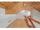 Hallway featuring wood ceiling, hardwood floor, brick accent wall, and wood railing for a craftsman style design at 441 Pumpkinvine Rd, Acworth, GA 30101