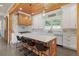 Spacious kitchen with a large island, stylish chairs, modern appliances, and elegant backsplash at 441 Pumpkinvine Rd, Acworth, GA 30101