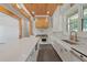 Bright kitchen featuring white cabinets, quartz countertops, stainless steel appliances, and an open floor plan at 441 Pumpkinvine Rd, Acworth, GA 30101