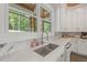 Bright kitchen featuring white cabinets, quartz countertops, stainless steel appliances, and a window view at 441 Pumpkinvine Rd, Acworth, GA 30101