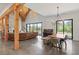 Open-concept room with large windows, modern lighting, a dining area, and comfortable living space at 441 Pumpkinvine Rd, Acworth, GA 30101