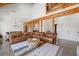 Open living room with concrete floors, wood beams, and ample seating near dining and kitchen at 441 Pumpkinvine Rd, Acworth, GA 30101