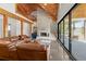 Inviting living room featuring a brick fireplace, high ceilings, and sliding glass doors at 441 Pumpkinvine Rd, Acworth, GA 30101