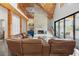 Open-concept living room with wood beams, fireplace, and polished concrete floors at 441 Pumpkinvine Rd, Acworth, GA 30101