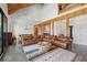 Living room open to the dining area and kitchen featuring vaulted wood ceilings and wood beams at 441 Pumpkinvine Rd, Acworth, GA 30101