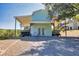 Shed with a covered carport with an open view of a large wooded backyard at 441 Pumpkinvine Rd, Acworth, GA 30101