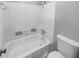 Bathroom with a white tub and toilet at 4958 Meadow Ln, Marietta, GA 30068