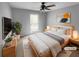 Serene bedroom featuring a ceiling fan, a comfortable bed, and natural light for a relaxing retreat at 4958 Meadow Ln, Marietta, GA 30068