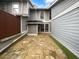 Charming flagstone patio area of gray two-story townhome with plenty of natural light at 4958 Meadow Ln, Marietta, GA 30068