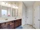 This bathroom features double sinks and ample cabinet space, offering convenience and style at 5619 Sawgrass Cir, Stonecrest, GA 30038