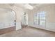 Bright dining room with wainscoting and large windows at 5619 Sawgrass Cir, Stonecrest, GA 30038