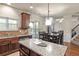 Kitchen featuring stainless steel appliances, a large island and dining area with large windows at 5619 Sawgrass Cir, Stonecrest, GA 30038