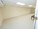 Finished basement offers a spacious area with neutral carpet and ample lighting, perfect for recreation at 100 Cross Creek Dr, Lilburn, GA 30047