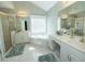 This bathroom features double sinks, large corner tub and a separate glass shower at 100 Cross Creek Dr, Lilburn, GA 30047