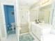 Bright bathroom has double sinks, shower and a separate toilet at 100 Cross Creek Dr, Lilburn, GA 30047