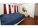 Bedroom with hardwood floors has a cross on the wall at 100 Cross Creek Dr, Lilburn, GA 30047