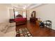 This spacious main bedroom features a four-poster bed, area rug and a tray ceiling at 100 Cross Creek Dr, Lilburn, GA 30047