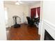 View of home office area with hardwood floors, desk, and fireplace at 100 Cross Creek Dr, Lilburn, GA 30047