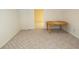 Cozy room with carpet flooring, a table, and doorway providing access to other rooms at 100 Cross Creek Dr, Lilburn, GA 30047