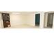 Open room with carpet flooring and a bookshelf offering an open layout leading to other rooms at 100 Cross Creek Dr, Lilburn, GA 30047