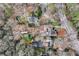 An aerial view of the property and surrounding neighborhood showcasing the mature trees and proximity to nearby amenities at 3776 Powers Ferry Nw Rd, Atlanta, GA 30342