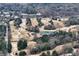 Aerial view of the golf course and surrounding neighborhood, showcasing the beautiful landscape and proximity to amenities at 3776 Powers Ferry Nw Rd, Atlanta, GA 30342