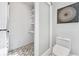 Modern bathroom boasts sleek toilet and a separate utility room with a sliding door, and stylish decor at 3776 Powers Ferry Nw Rd, Atlanta, GA 30342