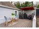 Cozy backyard deck with an outdoor dining area and a grill at 3776 Powers Ferry Nw Rd, Atlanta, GA 30342