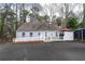Well-maintained home featuring a large driveway and outdoor living space at 3776 Powers Ferry Nw Rd, Atlanta, GA 30342
