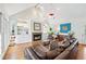 Spacious living room with a cozy fireplace, hardwood floors, and high ceilings at 3776 Powers Ferry Nw Rd, Atlanta, GA 30342