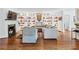 Elegant living room with a fireplace, built-in shelving, and comfortable seating at 3776 Powers Ferry Nw Rd, Atlanta, GA 30342