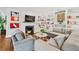 Inviting living room with a fireplace, built-in shelves, and a comfortable sectional sofa at 3776 Powers Ferry Nw Rd, Atlanta, GA 30342