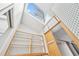 Sunlit walk-in closet featuring built-in shelves and a skylight, combining functionality with natural light at 3776 Powers Ferry Nw Rd, Atlanta, GA 30342