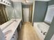 Bathroom featuring double sinks, a soaking tub, and a separate shower at 412 Pine Log Ct, Canton, GA 30115