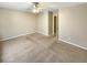 Spacious bedroom with neutral carpet, ceiling fan, and ample space, perfect for relaxation and rest at 412 Pine Log Ct, Canton, GA 30115