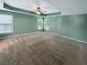 Large bedroom with soft carpet, recessed ceiling, ceiling fan, and bright natural light at 412 Pine Log Ct, Canton, GA 30115