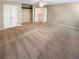 Spacious bedroom featuring plush carpeting, a ceiling fan, and a large double-door closet at 412 Pine Log Ct, Canton, GA 30115