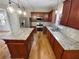 Kitchen featuring an island and granite countertops, stainless steel appliances, and ample cabinet space at 412 Pine Log Ct, Canton, GA 30115