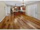 Open-concept kitchen with stainless steel appliances, dark wood cabinets, and a view of the dining area at 412 Pine Log Ct, Canton, GA 30115