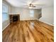 Spacious living room with hardwood floors and a fireplace, ready for your personal touch at 412 Pine Log Ct, Canton, GA 30115