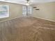 Spacious main bedroom with a large window, plush carpet, and ample natural light at 412 Pine Log Ct, Canton, GA 30115